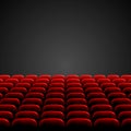 Rows of red cinema or theater seats in front of black blank screen. Wide empty movie theater auditorium with red seats. Vector