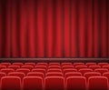 Rows of red cinema or theater seats in front of show stage Royalty Free Stock Photo