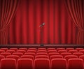 Rows of red cinema or theater seats in front of show stage Royalty Free Stock Photo