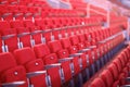 Rows of red numbered seats with armrests