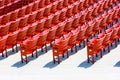 Rows of red plastic seats