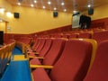 Rows of red seats inside a cinema