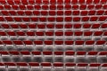 Rows of red seats on the stadium. Empty red plastic chairs Royalty Free Stock Photo