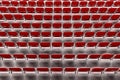 Rows of red seats on the stadium. Empty red plastic chairs Royalty Free Stock Photo