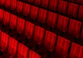 Rows of red velvet seats watching movies in the cinema with copy space banner background. Entertainment and Theater concept. 3D Royalty Free Stock Photo