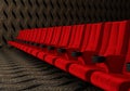 Rows of red velvet seats watching movies in the cinema with copy space banner background. Entertainment and Theater concept. 3D Royalty Free Stock Photo