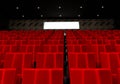 Rows of red velvet seats watching movies in the cinema with copy space banner background. Entertainment and Theater concept. 3D Royalty Free Stock Photo