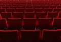 Rows of red velvet seats watching movies in the cinema with copy space banner background. Entertainment and Theater concept. 3D Royalty Free Stock Photo