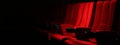 Rows of red velvet seats watching movies in the cinema with copy space banner background. Entertainment and Theater concept. 3D Royalty Free Stock Photo