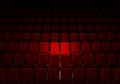 Rows of red velvet seats watching movies in the cinema with spotlight only couple deluxe seat background. Entertainment and Royalty Free Stock Photo