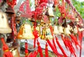 Rows of red wind bells golden buddhist prosperity bell at chinese temple people wish and hang them Royalty Free Stock Photo