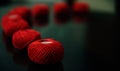 Rows of red yarn balls on a glass surface Royalty Free Stock Photo