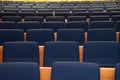 Empty lecture theatre with blue seats. Royalty Free Stock Photo