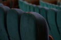 Rows of seats in the auditorium in the cinema, soft seat backs, empty room, before the event