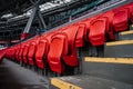 Rows of seats in a football stadium. Bright red stadium seats. Royalty Free Stock Photo