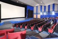 Rows of seats and screen in Neva cinema