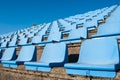 Rows of seats of a small tribune of a stadium