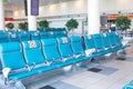 Rows seats in the waiting room with a sign applied- do not occupy, do not sit down. Social distance concept, pandemic precautions