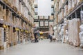 Rows of shelves with boxes in modern warehouse