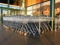 Rows of shopping trolleys at supermarket entrance Royalty Free Stock Photo