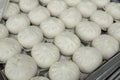 Rows of Siopao buns at the kitchen of a restaurant. Philippine indigenized version of the Cantonese steamed bun Royalty Free Stock Photo