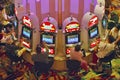 Rows of slot machines and gamblers at Rio Casino in Las Vegas, NV