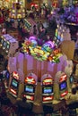 Rows of slot machines and gamblers at Rio Casino in Las Vegas, NV