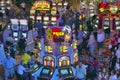 Rows of slot machines and gamblers at Rio Casino in Las Vegas, NV