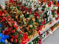 Rows of small Christmas trees in perspective in Christmas decorations. Winter cozy style. Hygge concept Royalty Free Stock Photo