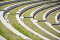 Rows of stairs and grass in the amphitheater. Modern architecture and landscape design in the park.