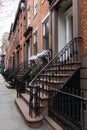 Stairs Leading to the Entrances of Old Brick Homes along a Sidewalk in Greenwich Village of New York City