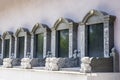 Rows of stone tombstones in a public cemetery