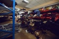 Rows of storage shelves full of fabric and leather rolls at footwear or clothing factory Royalty Free Stock Photo