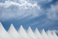 Rows of tents under cloudy skies