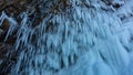 Rows of thin long stalactite icicles