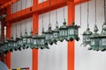 Rows of traditional bronze lanterns hanging in Kasuga Taisha Shrine