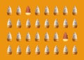 Rows of Two Types of Soft Serve Ice Cream Cones Pattern on Orange Background Royalty Free Stock Photo