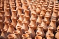 rows of unpainted clay vases