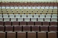Rows of vacant spectators seats in theater. Abstract background