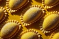 Rows of vibrant yellow mezzelune pasta ready for cooking Royalty Free Stock Photo