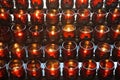 Rows of votive candles in red glass Royalty Free Stock Photo