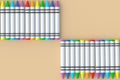 Rows of wax crayons on beige background. Colorful pencils. Back to school concept
