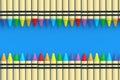 Rows of wax crayons on blue background. Colorful pencils. Back to school concept. Preschool education
