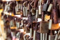 Rows of wedding locks hanged on the railing of love bridge