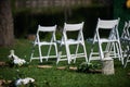 Rows of white chairs arranged for a wedding ceremony Royalty Free Stock Photo