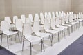 Rows of white chairs in presentation room Royalty Free Stock Photo