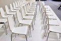 Rows of white chairs in presentation room Royalty Free Stock Photo