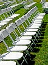 Rows of white folding chairs