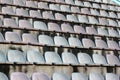 Rows of white plastic seats at a stadium Royalty Free Stock Photo