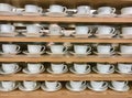 Rows of white tea cups Royalty Free Stock Photo